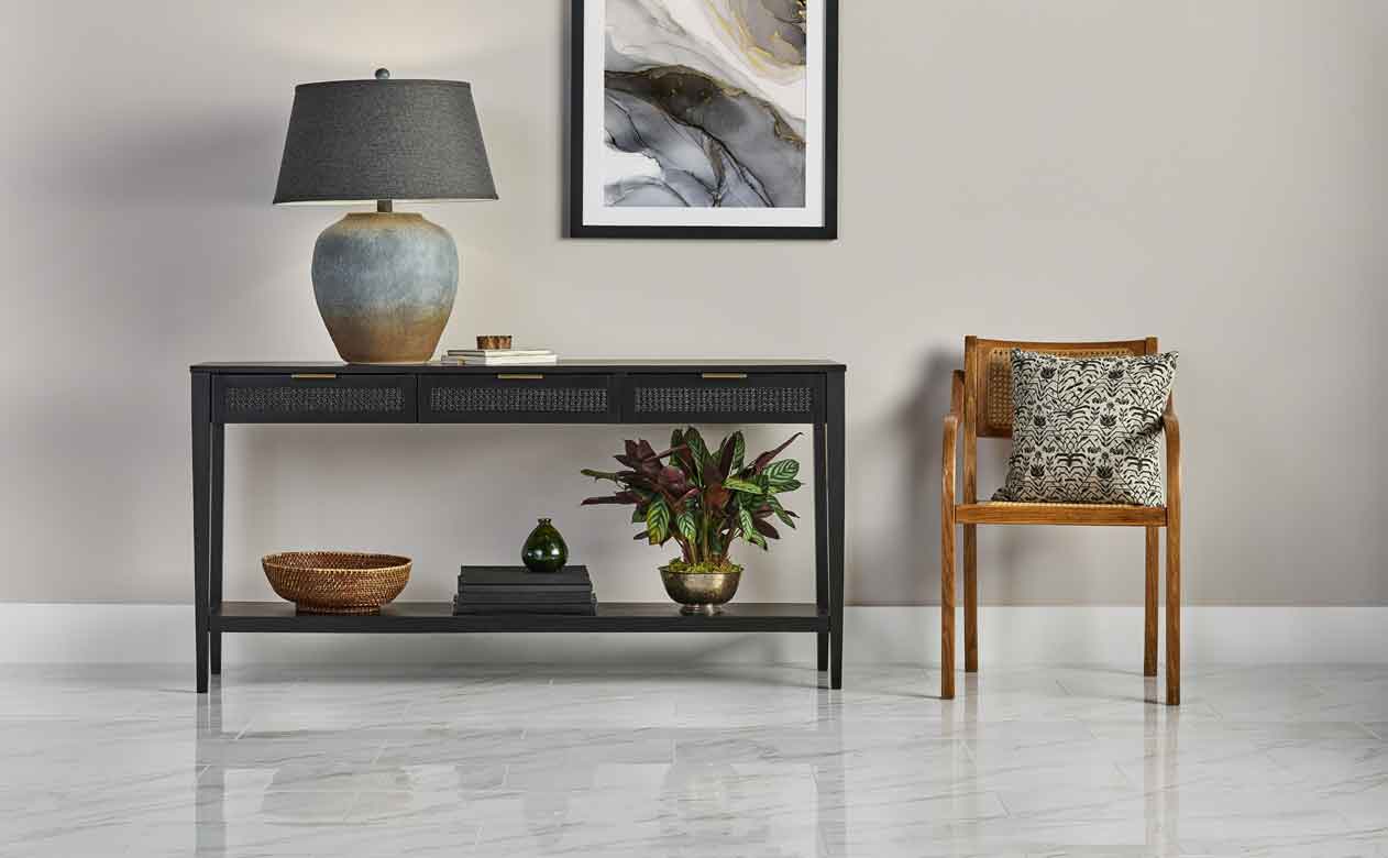 Living room in Texas with Woven Drawer Console Table Black and marble look tile flooring
